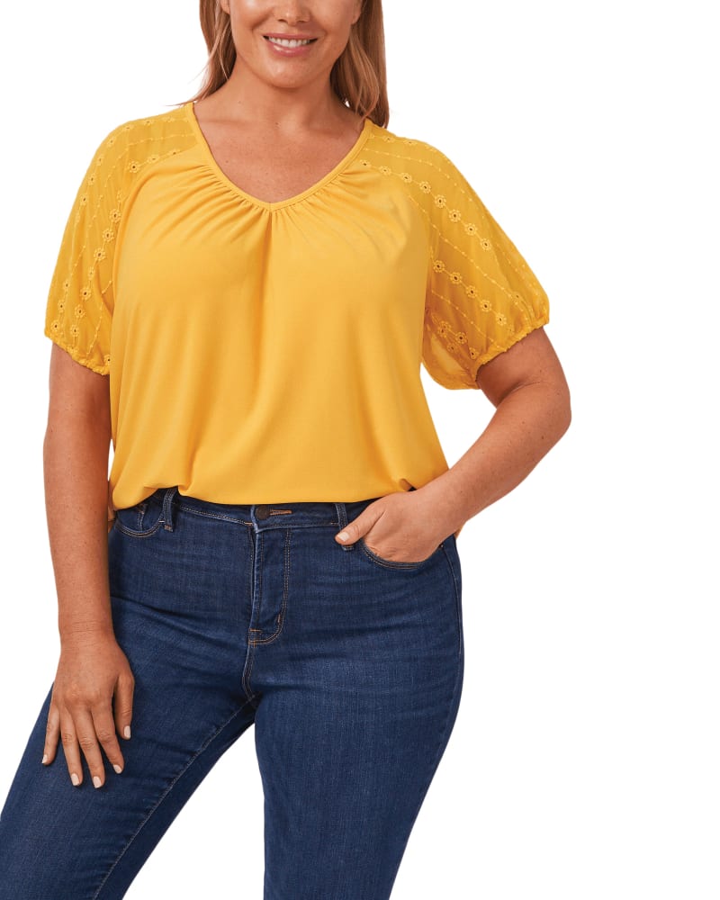 Front of a model wearing a size 1X Mila Embroidered Puff Sleeve Top in 790-GOLDEN HOUR by CeCe. | dia_product_style_image_id:263438